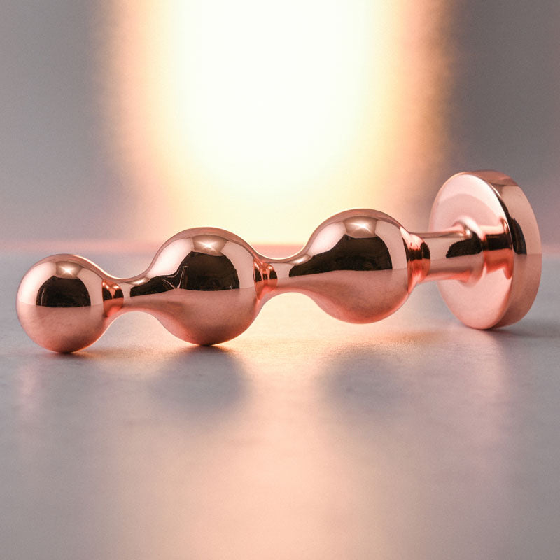 Gender X GOLD DIGGER SMALL - Rose Gold Small Butt Plug with Black Gem Base
