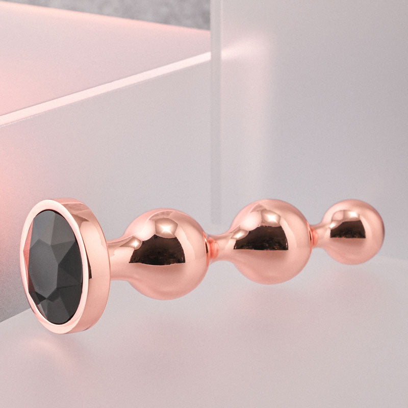 Gender X GOLD DIGGER SMALL - Rose Gold Small Butt Plug with Black Gem Base
